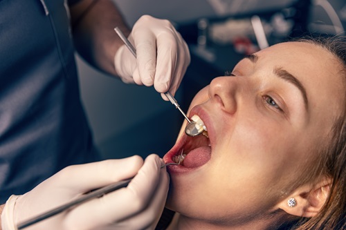 dentist checking bleeding gums